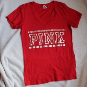 Pink T-shirt with silver lettering